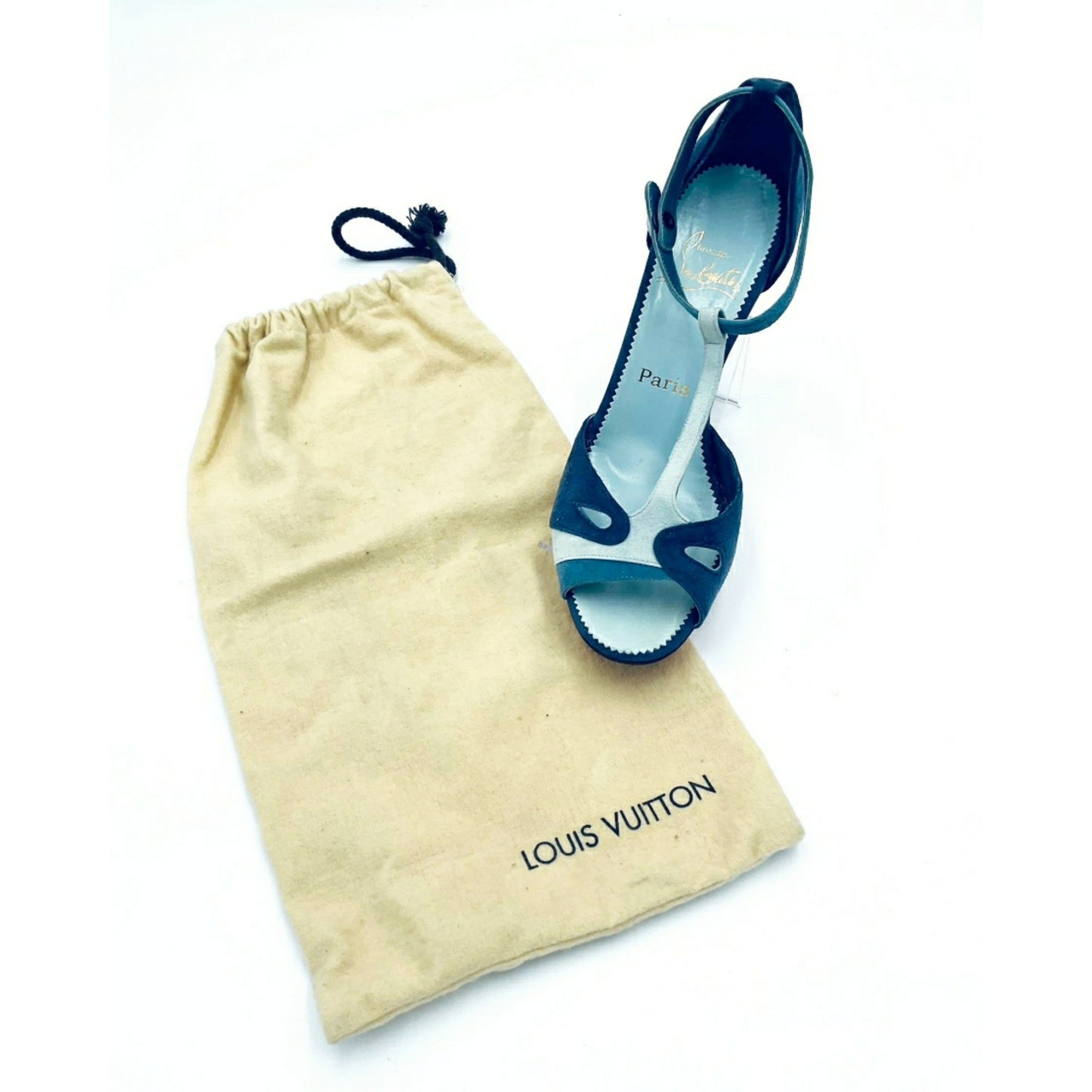 Louboutin high heels, featuring a suede texture and a gradient of light to dark blue, with the brand's distinctive red sole