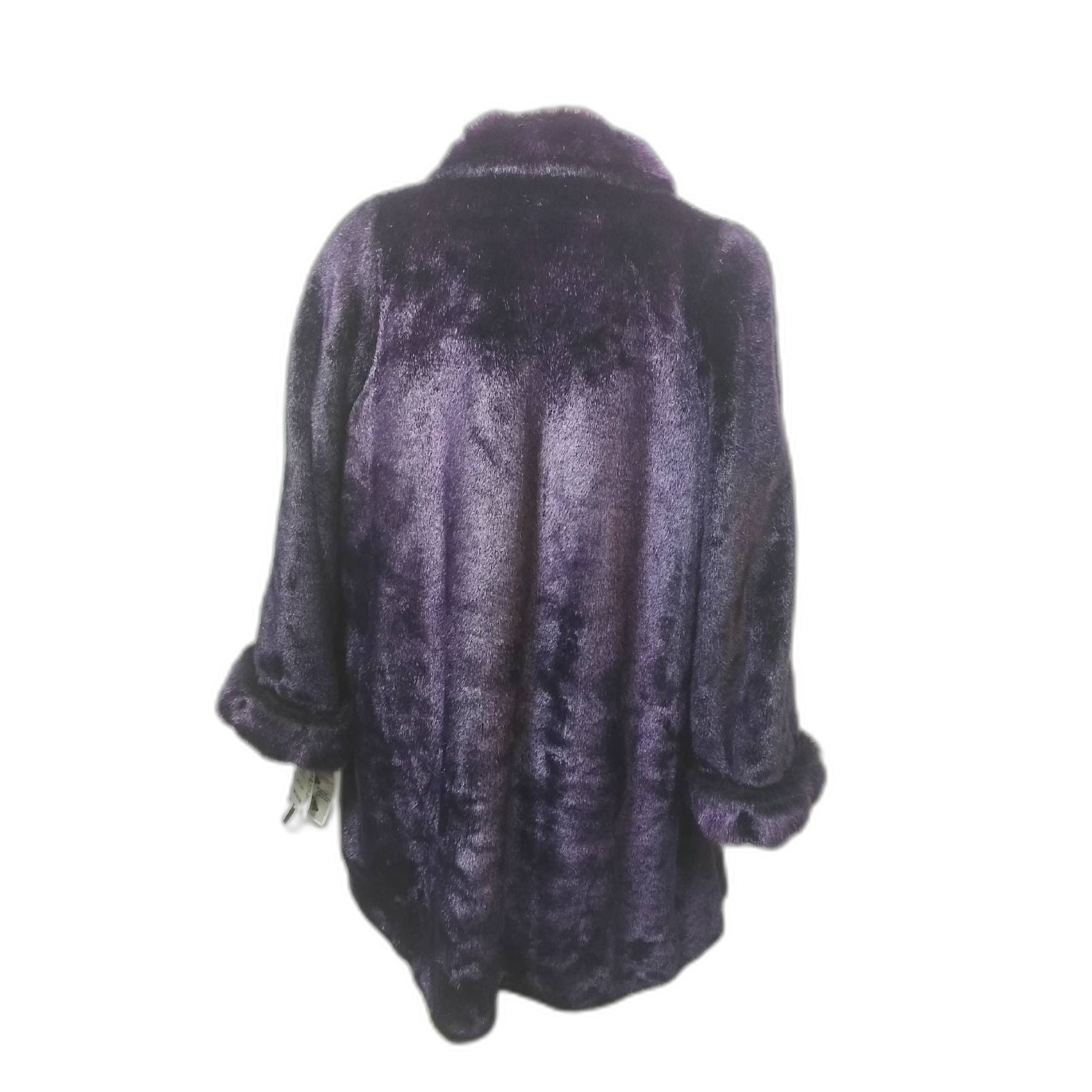 What a beautiful and gorgeous purple faux fur coat. Original tags, referred to as "Dead Stock" still attached and never worn.