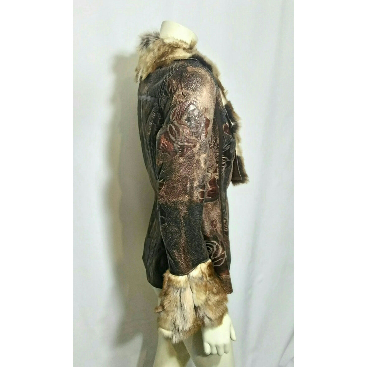 A dark brown distressed looking  jacket with faux fur trim on a mannequin, photographed against a white fabric backdrop.