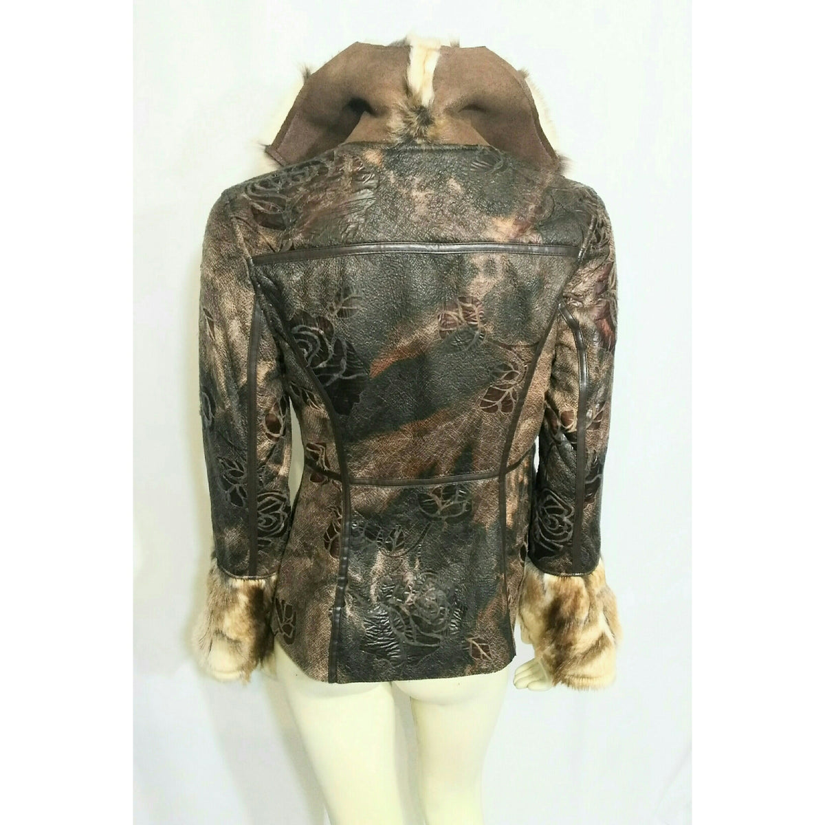 A women's long-sleeve  jacket with an embossed floral pattern in brown and black, featuring a brown faux-fur collar and cuffs, displayed on a cream mannequin against a white background.