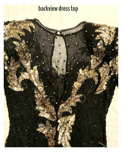 Back view of a black lace dress top with ornate gold sequin embroidery and rhinestones, labeled 'backview dress top' on a light beige background.