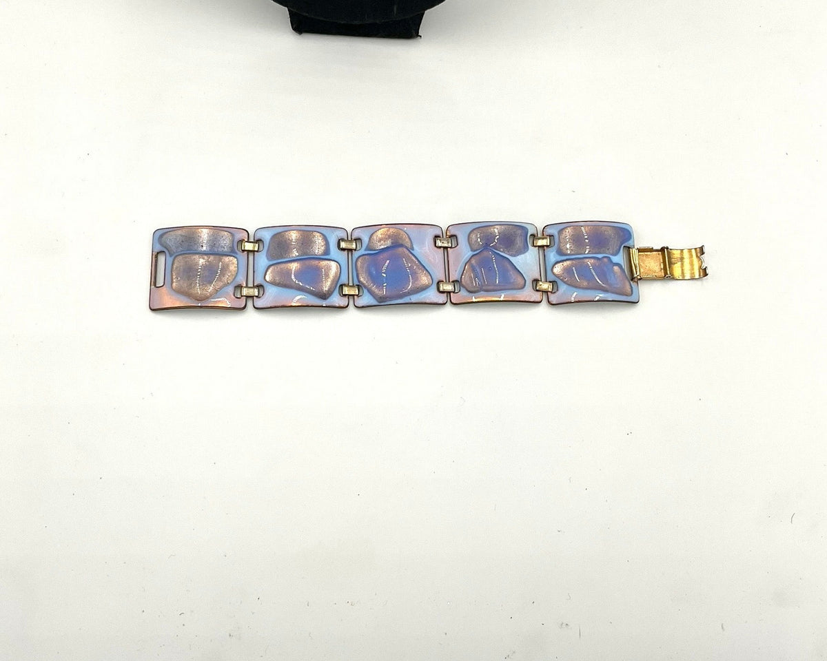 bracelet  color palette is exceptional: a striking opalescent blue enamel with beautiful hints of lavender and purple tones metal, glass accents.