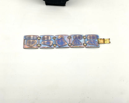 bracelet  color palette is exceptional: a striking opalescent blue enamel with beautiful hints of lavender and purple tones metal, glass accents.