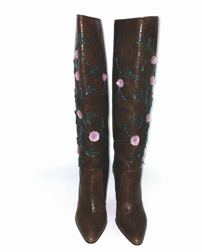 Brown  boots knee-high lizard skin print adorned with intricate sequins and floral details.  