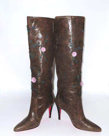Brown  boots knee-high lizard skin print adorned with intricate sequins and floral details.  