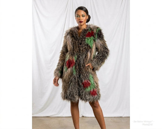 A luxurious genuine woven fox fur coat with colorful fur accents worn by model. The coat has a collarless design, with red and green fur woven into the natural brown fur pattern.