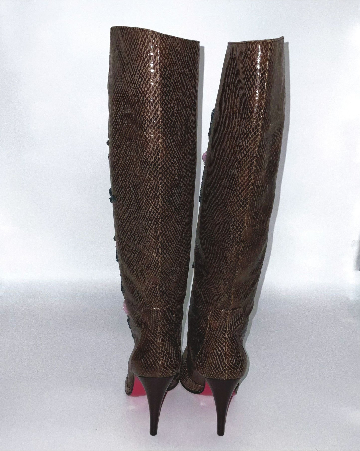 Brown  boots knee-high lizard skin print adorned with intricate sequins and floral details.  