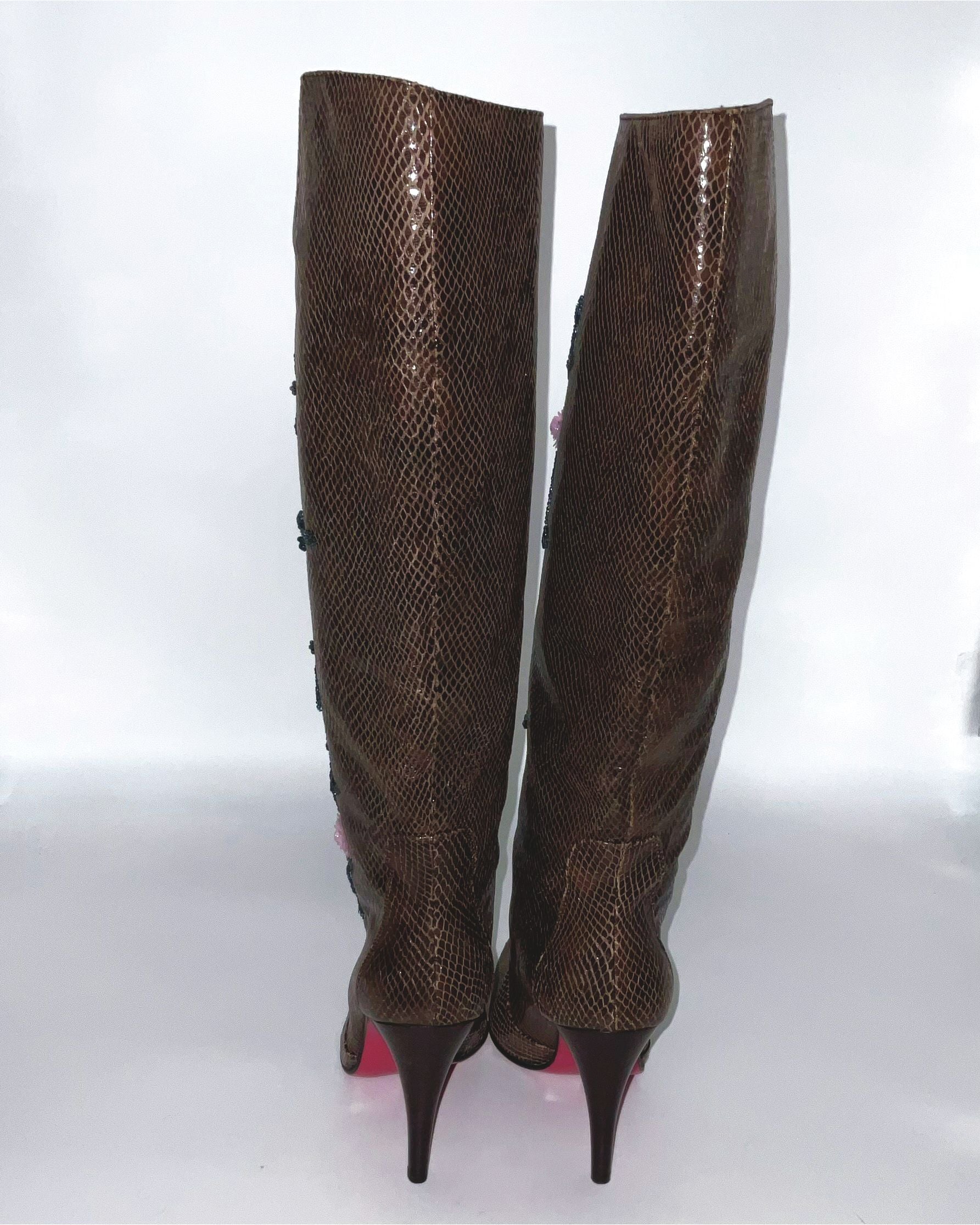 Brown  boots knee-high lizard skin print adorned with intricate sequins and floral details.  
